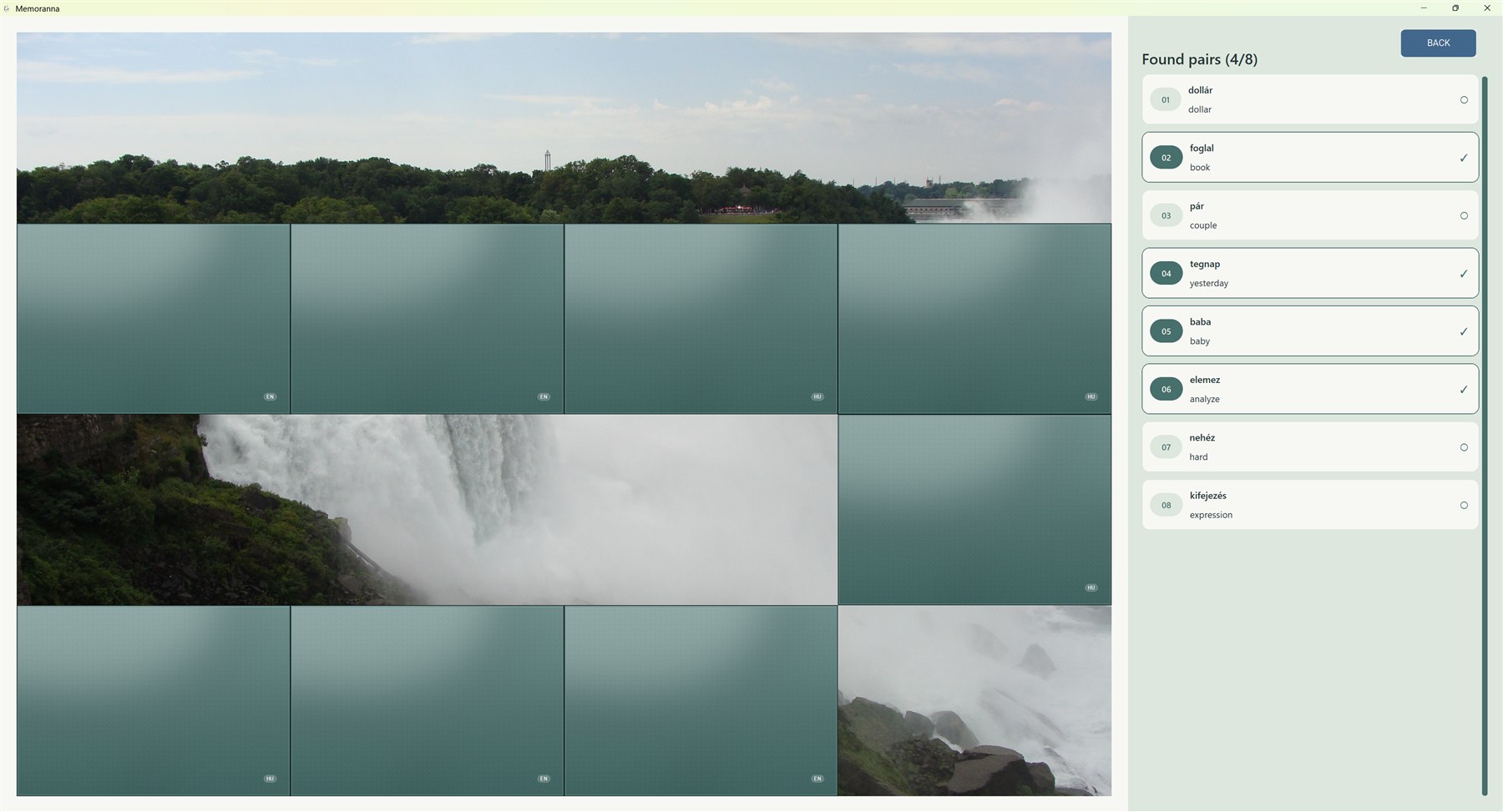 Memoranna game with matched word cards removed to reveal parts of a waterfall photograph